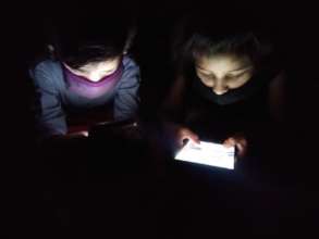 Children surfing their homework on internet