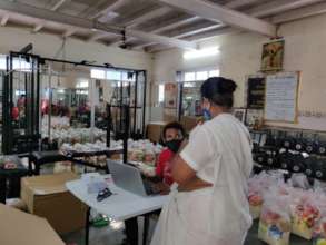 OSCAR team providing urgent food rations.