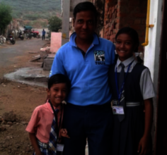 TOLFA staff member Bunty with his children