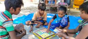 Children learning to play board games