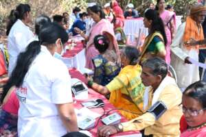 Health sakhis (CHWs) screening blood pressure