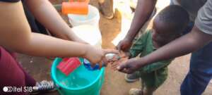 Children participating in handwashing