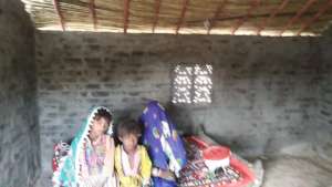 Family Sitting inside Newly Build House