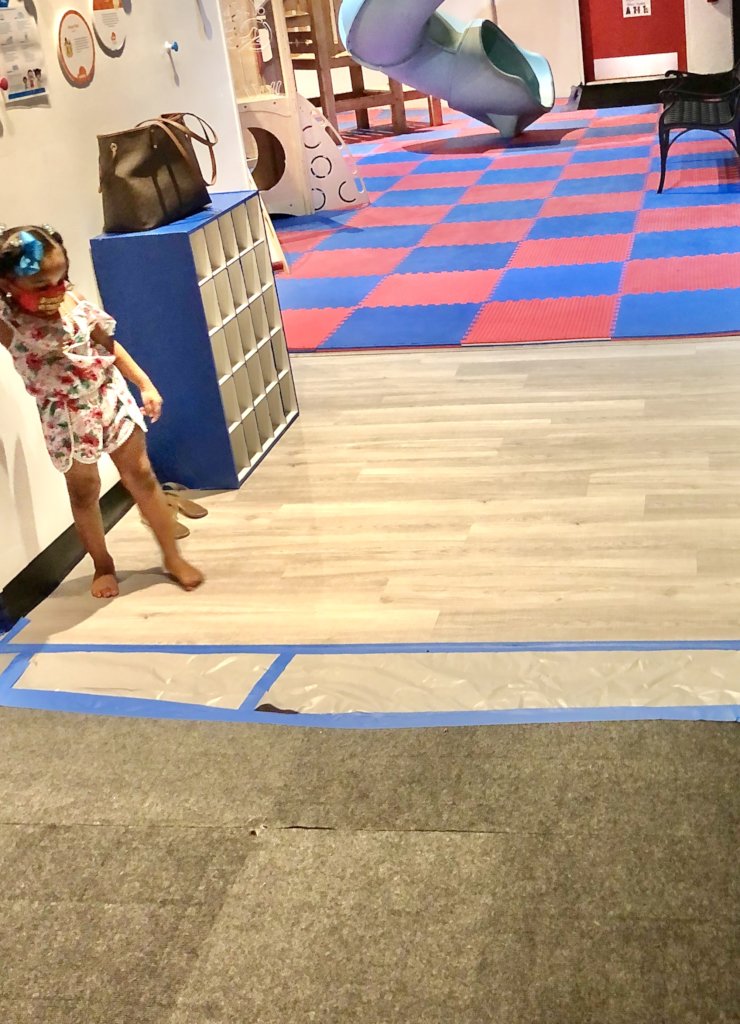 A child enjoys a small section of new flooring