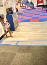 A child enjoys a small section of new flooring