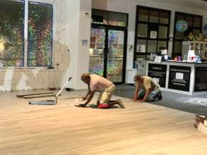 Volunteers Help Install Vinyl Plank Flooring