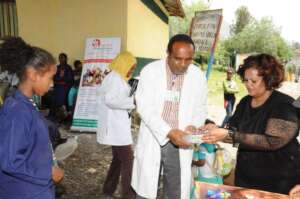 A partial view of a  girl  receiving edu materials