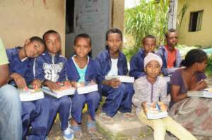A partial view of a  girl  receiving edu materials