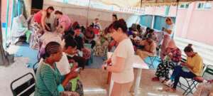 partial of  young women when they supportd bv MHO