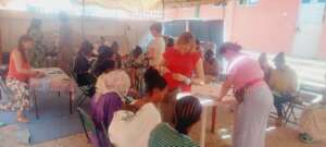 partial of women when they supportd bv volunteer
