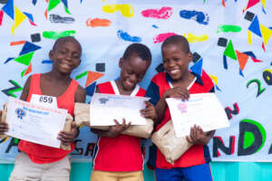 Showing off awards at Zara's mini-marathon.