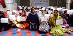 Entrepreneurs proudly displaying graduation certs