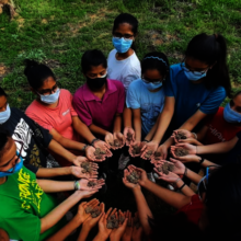 Children planting seeds for the environment