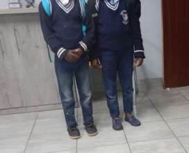 The twin children at their first day in school