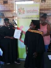 A young woman graduating from skills training