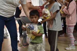 Kid receiving food.