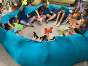 Volunteers help during music activities