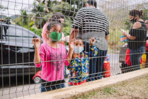 children line up to pick up their food