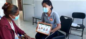 Providing Regular Health Education wearing a mask