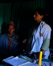 PHASE Nepal staff helping the man to heal