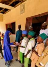 Pupils receiving their books
