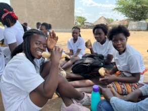 Girls enjoying a snack during a mentorship meeting