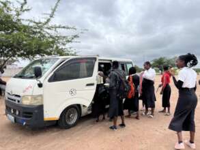 Girls boarding the school bus
