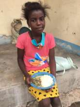 A sixth grade student in Cumba village