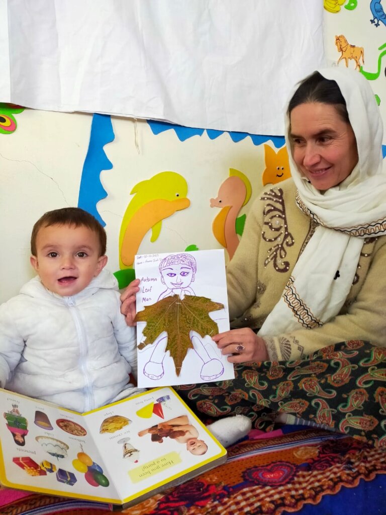 Child and mother engaged in autumn activity