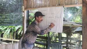 A local, senior farmer leads the training