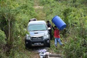 Carrying kit to distant Singkil site