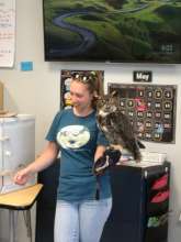 Noelle, an instructor, showing Bella, the owl.