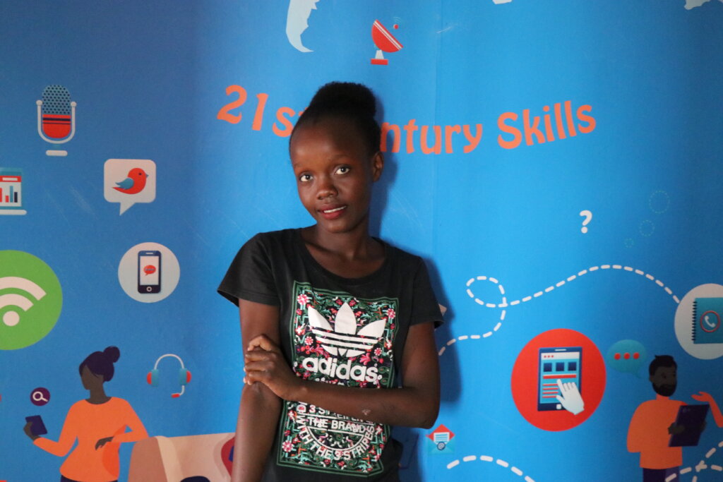 Smiling girl at Elimu's DigiTech Lab in Kenya