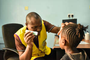 Optician -patient consultation at the Eye Camp