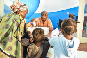 Grandmother with her grandchildren at the Eye Camp