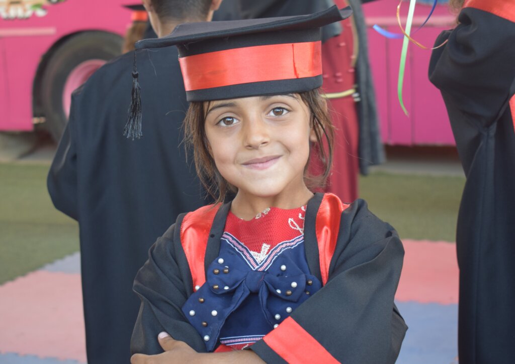 A girl graduates from the Hope Bus!