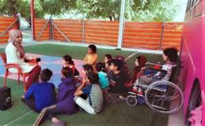 A girl with  wheelchair joins the Hope Bus classes