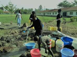 Students rush for the first clear water