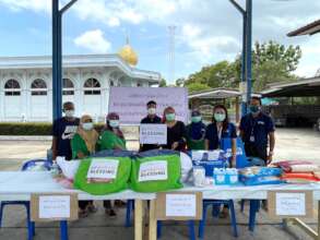 Handing over essential items to the community