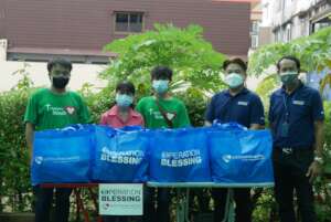 Handing over survival bags to Saeng Santi Village