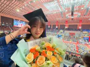 Gigi in her graduation ceremony in 2024