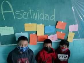 Damian, Dilan y Arturo in a class on assertiveness