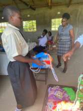 A girl receiving a kit