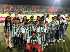 Enjoying a soccer match with jerseys and all
