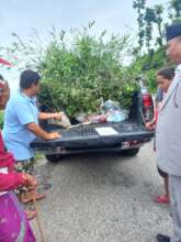 Beneficiaries getting fruit sapling