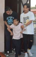 Two senior boys help our special needs girl