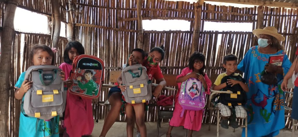 Showing off their new backpacks