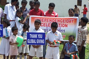 CHILDREN ENJOYING THE TRI-COLOR FLAG