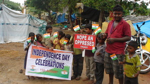 children happy to receive national flags