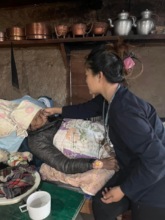 Shanti taking care of elderly patient.